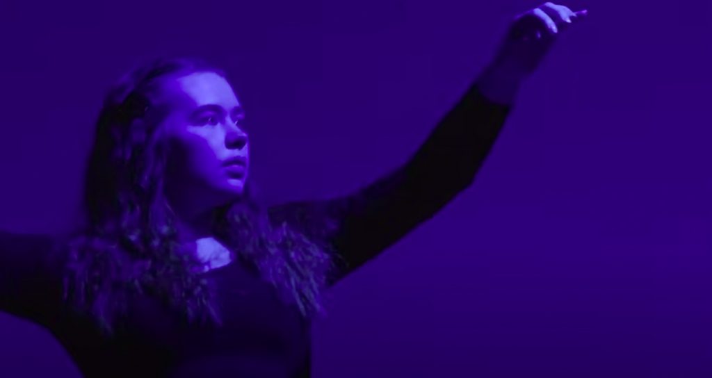 A dancer in blue light