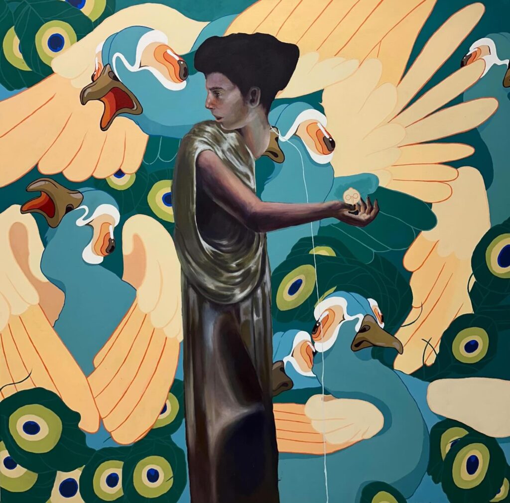 A woman in a long, flowing dress stands in profile, holding a small round object. She is set against a vibrant background filled with stylized, colorful peacocks with open beaks and dramatic feather patterns.